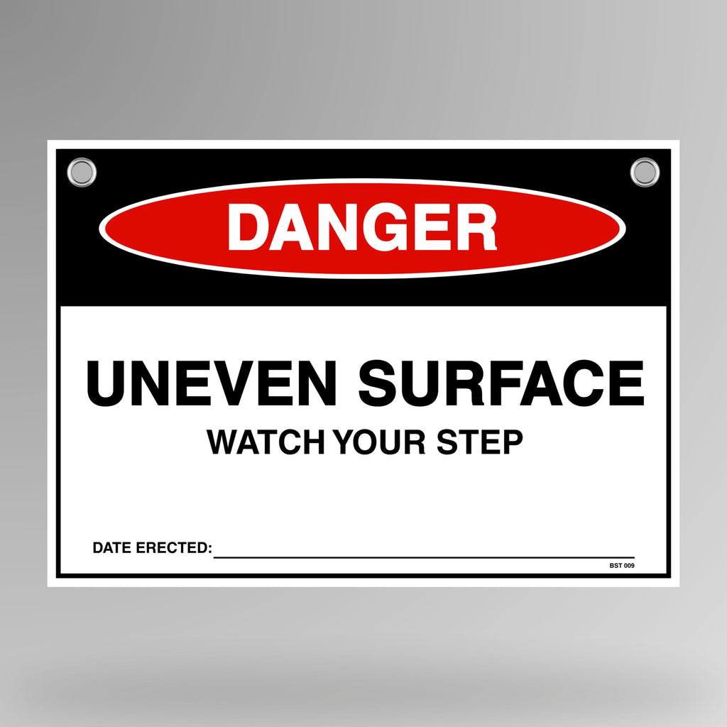 Danger Uneven Surface Watch Your Step flag tag hanging on white bunting rope with metal eyelets.