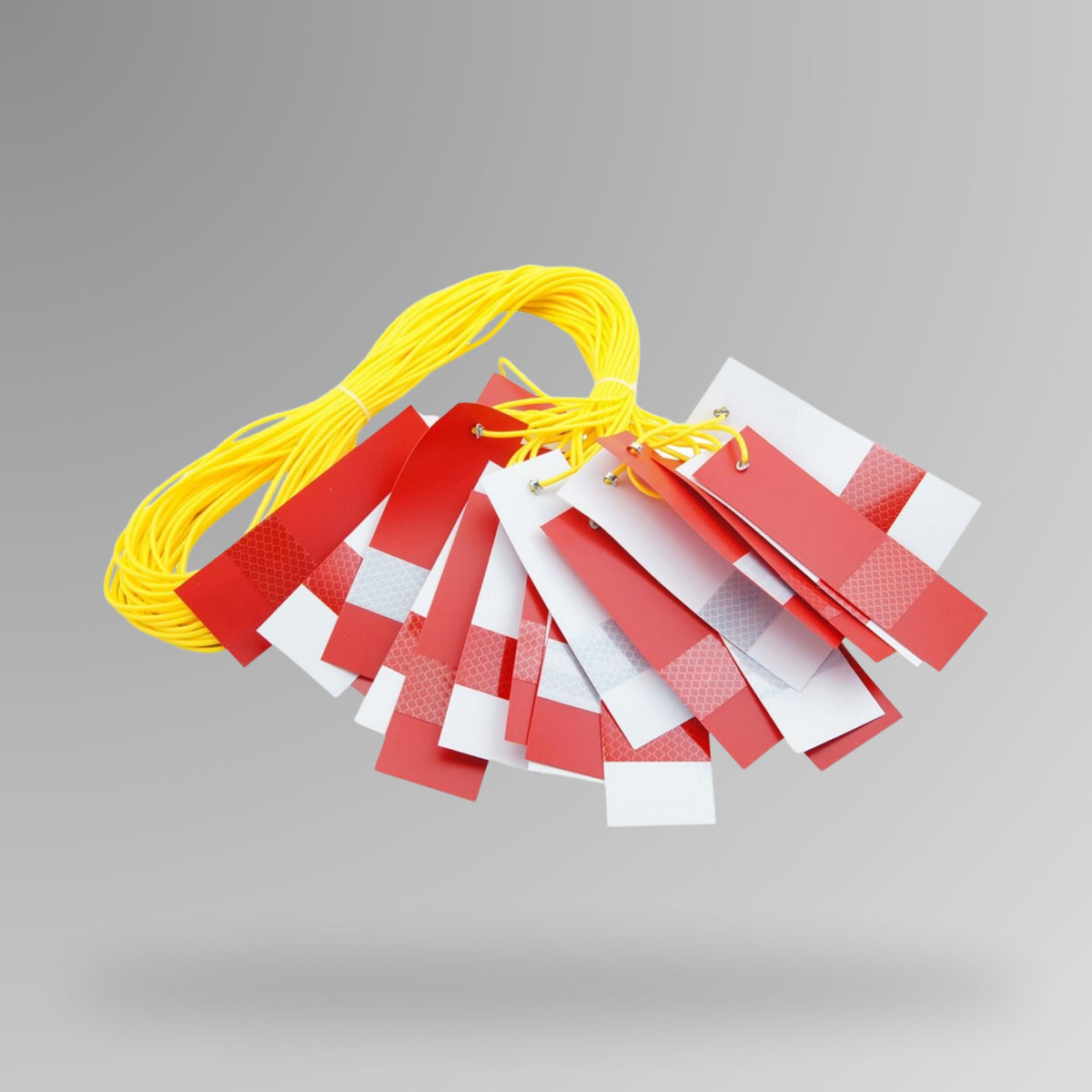 BMT 017 red and white reflective bunting line shown as a 25m wrapped roll in plastic packaging with On Site Safety label, featuring alternating red and white triangular flags on yellow cord for low light site barricading.
