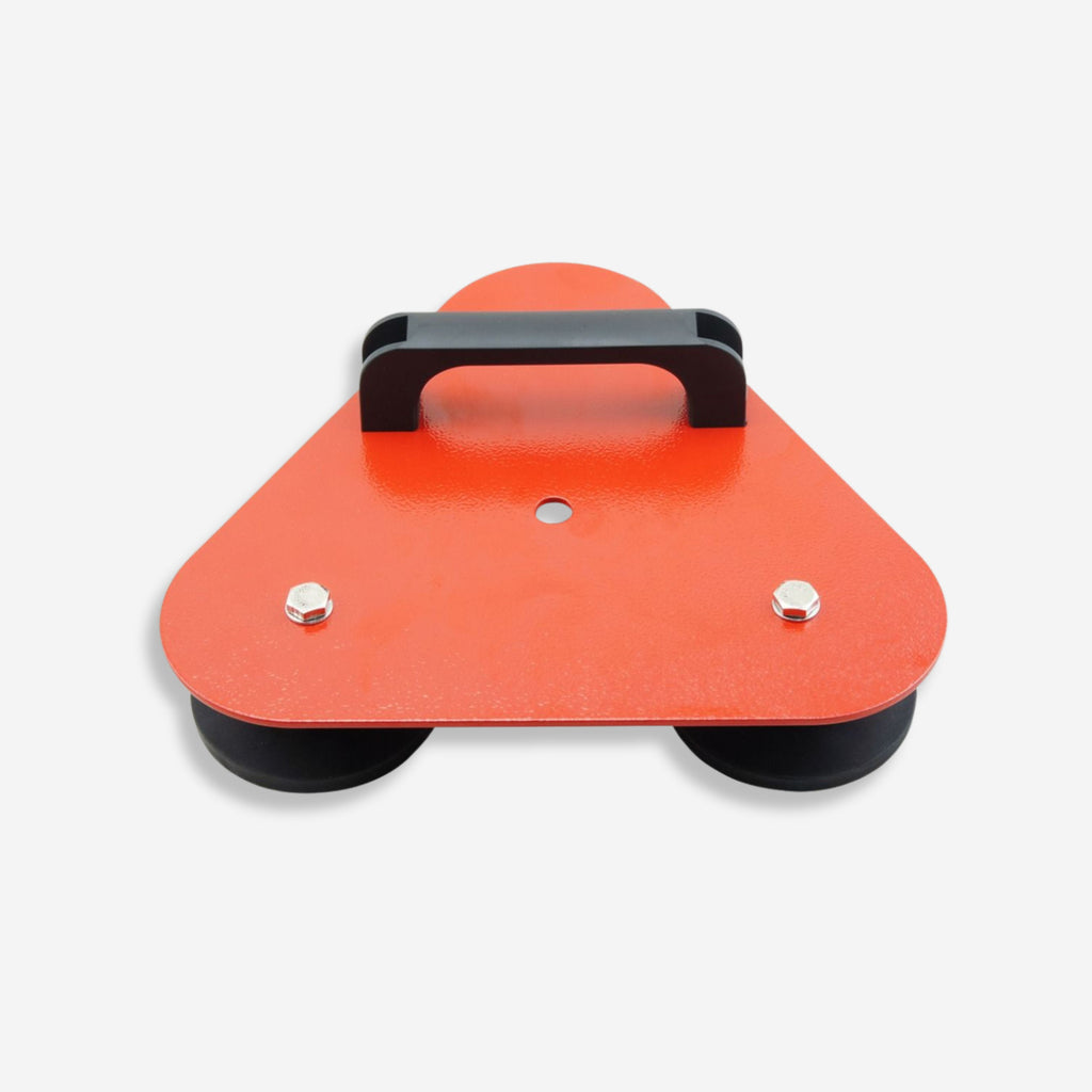 Underside detail of the BVS 009 mine flag magnetic base showing two black rubber magnetic pads and bolt fixings on the orange powder coated triangular steel plate.