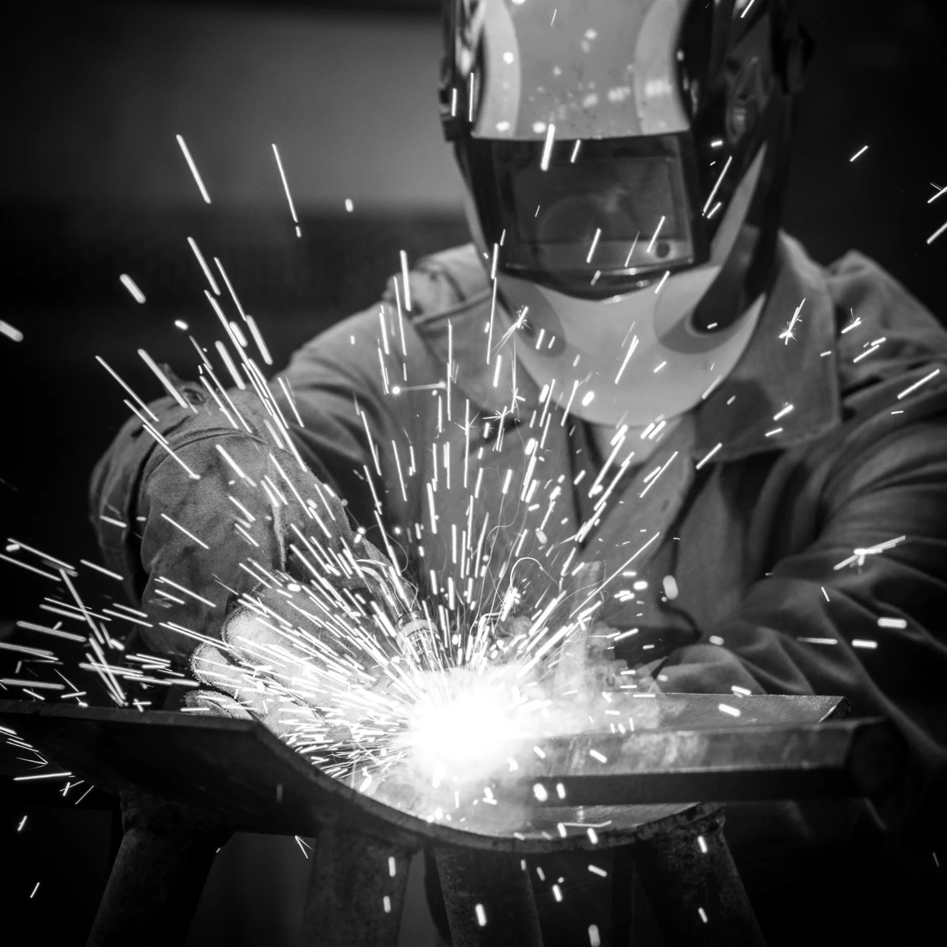 Man welding, sparks flying