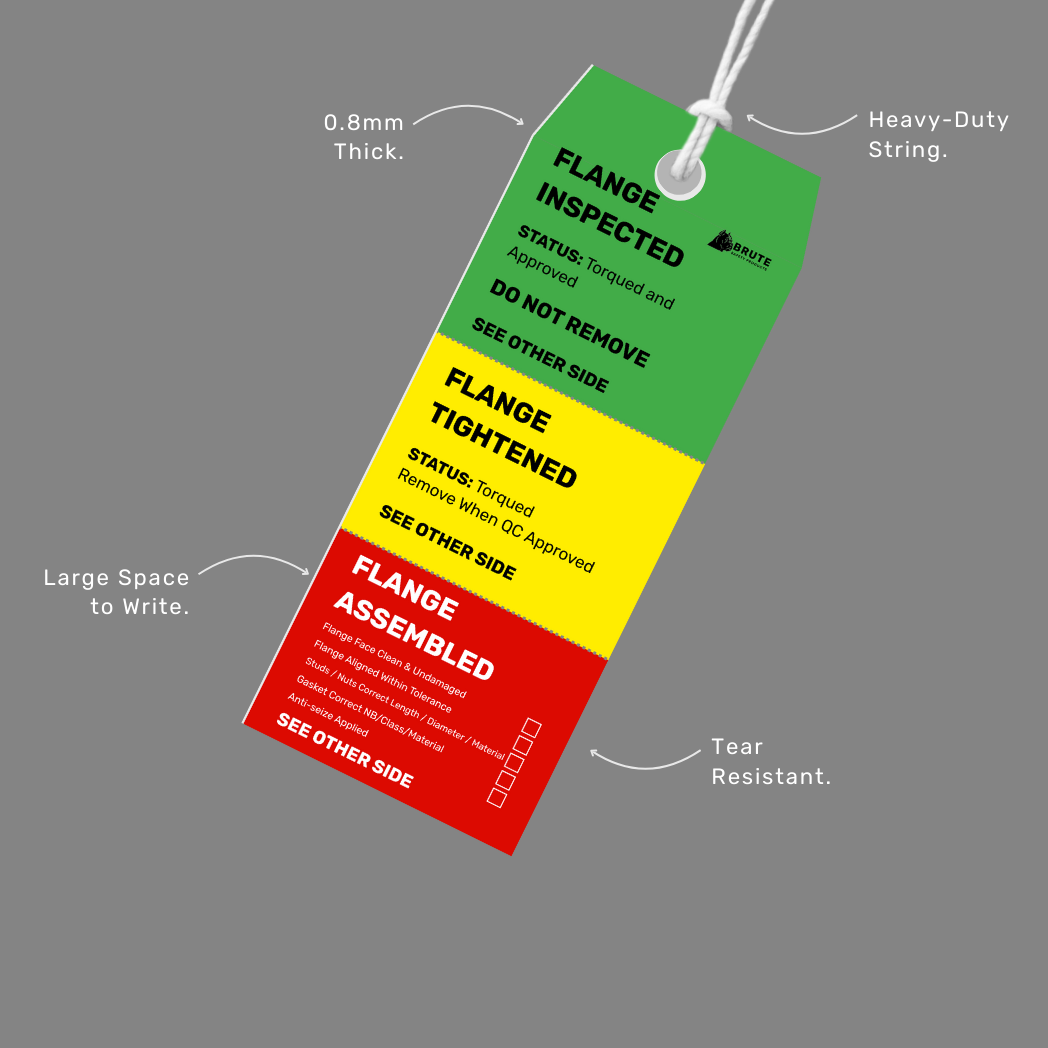 Colorful inspection tag with text and labels on a gray background