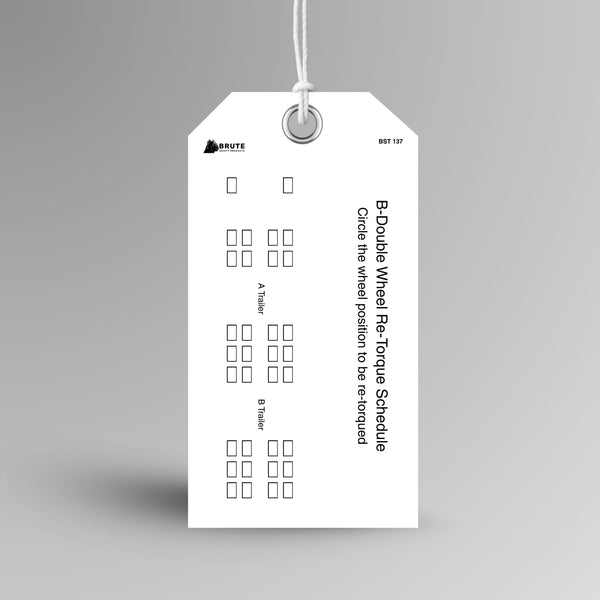 BST 137 B Double Wheel Re-Torque Schedule tag hanging from white string through a metal eyelet, with A Trailer and B Trailer wheel position diagrams and sideways title text.