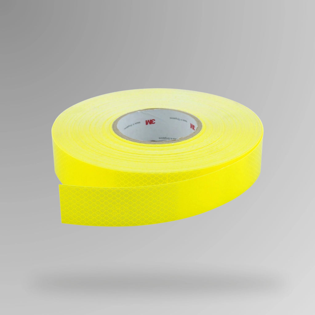 Upright roll of 3M Diamond Grade 4000 Series reflective tape in fluro yellow showing 50mm width and adhesive backing with Class 1000 rating label