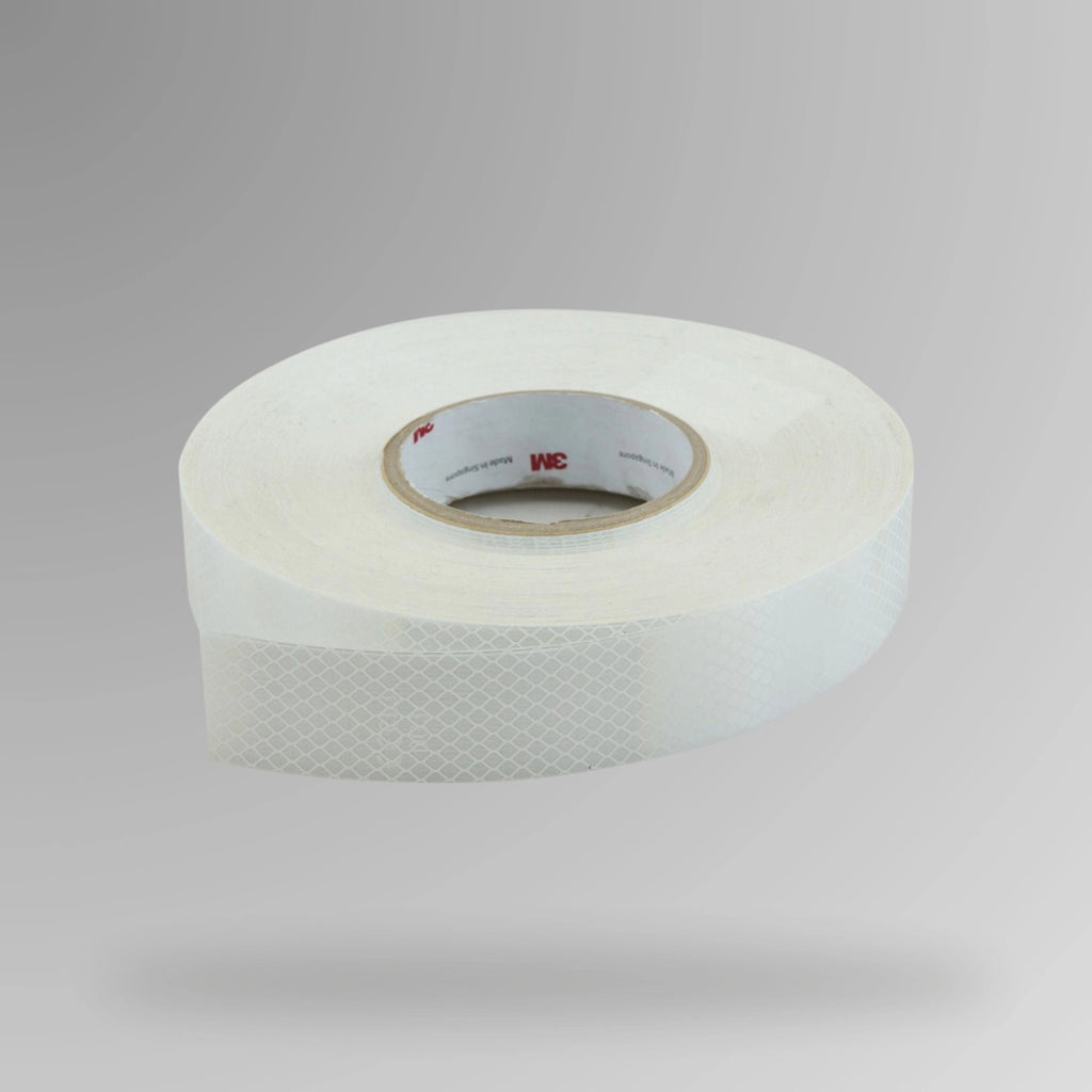 Upright roll of 3M Diamond Grade 4000 Series reflective tape in fluro white showing 75mm width and adhesive backing with Class 1000 rating label