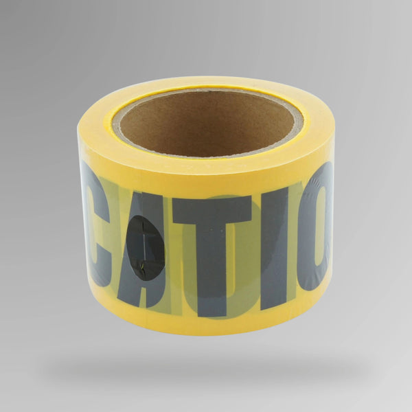 Upright roll of yellow caution barrier tape showing double side black stripes and caution text printing on polyethylene material