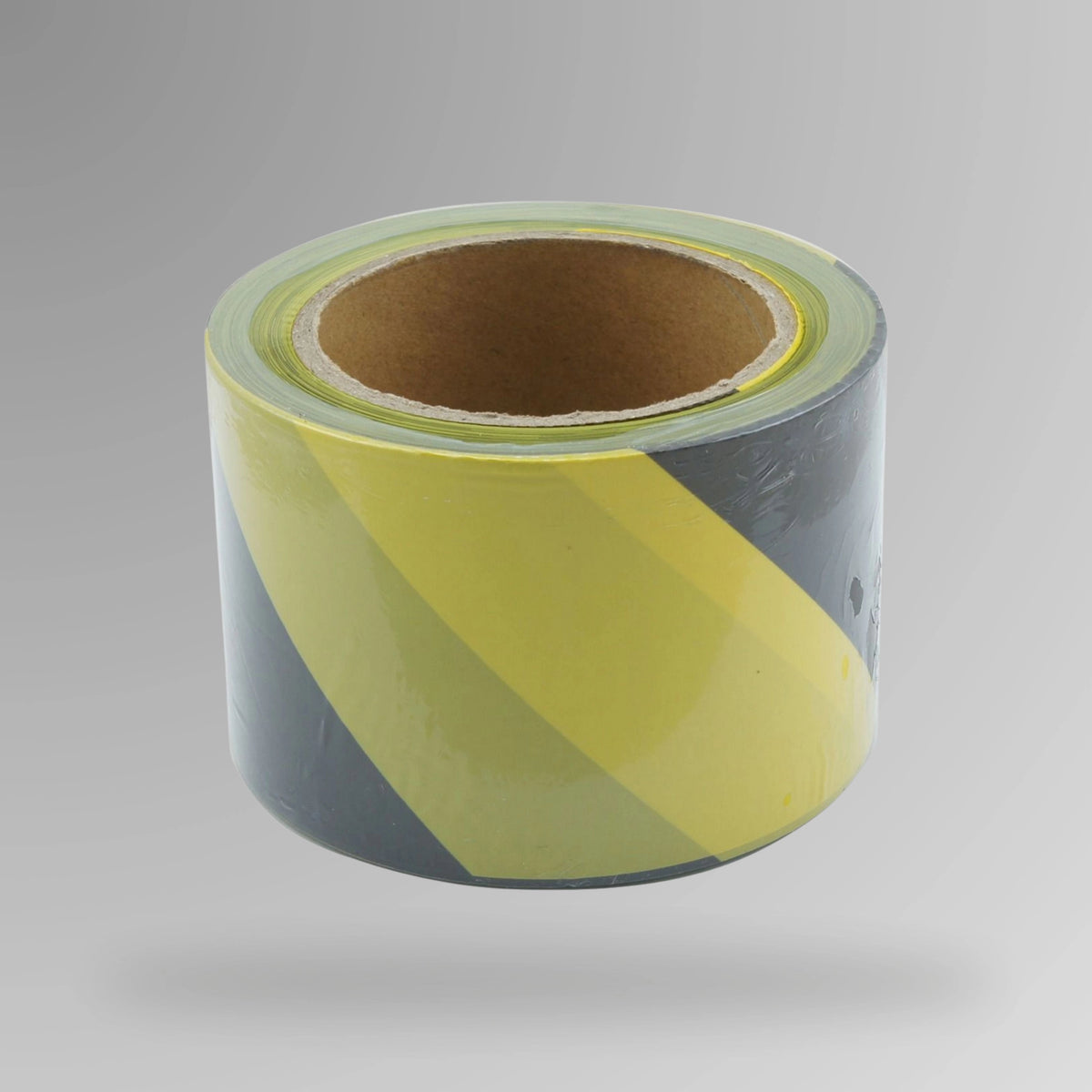 Upright roll of black and yellow striped barrier tape showing alternating colour pattern and text printing on polyethylene material