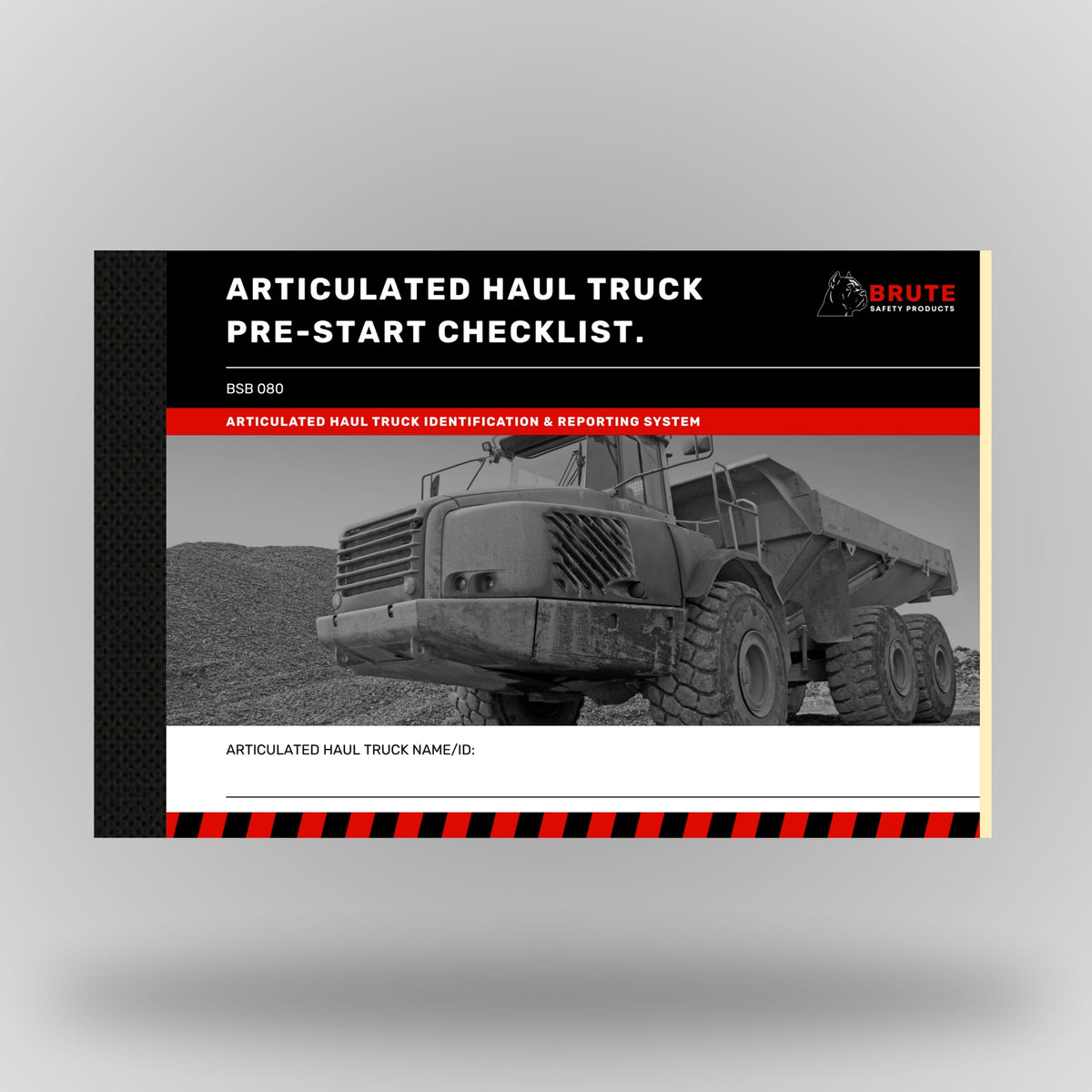 Brute Safety Products BSB 080 Articulated Haul Truck Pre-Start Checklist Book in A5 landscape format, showing black cover with red banner, Brute Safety logo and greyscale image of an articulated haul truck on a quarry site with aggregate stockpiles in the background. Includes articulated haul truck name and ID field.