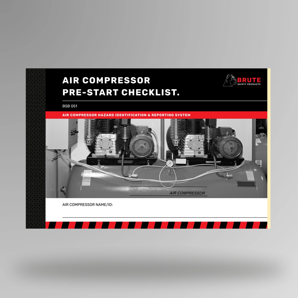 Upright view of BSB 051 Air Compressor Pre Start Checklist book displaying cover title and taped spine binding.