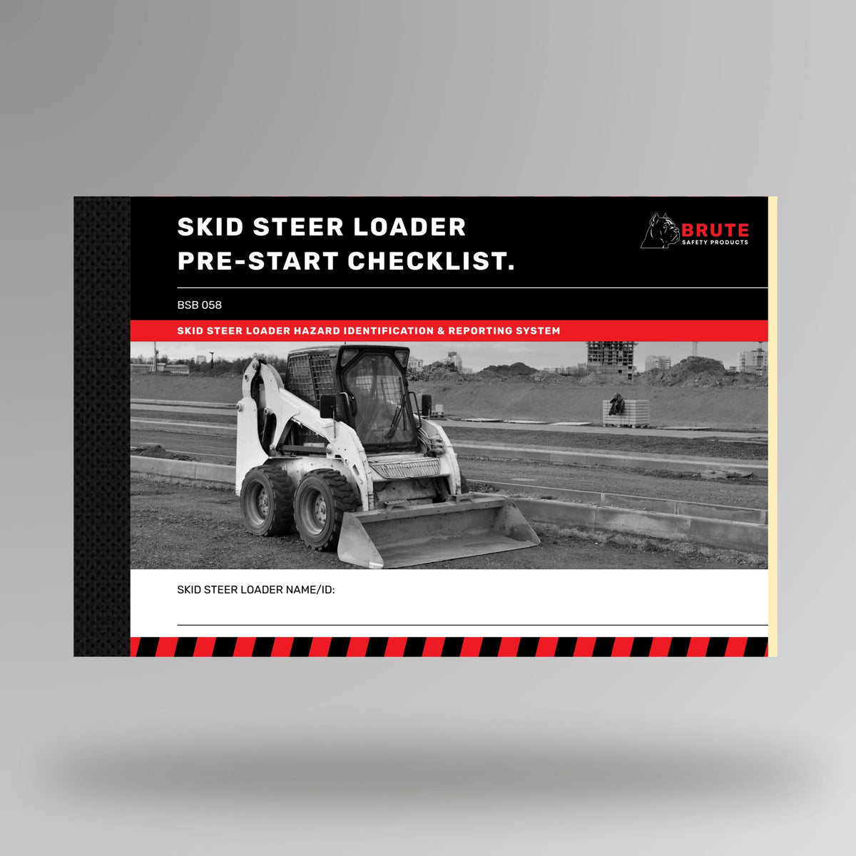 Upright view of BSB 058 Skid Steer Loader Pre Start Checklist book displaying cover and taped spine edge detail.