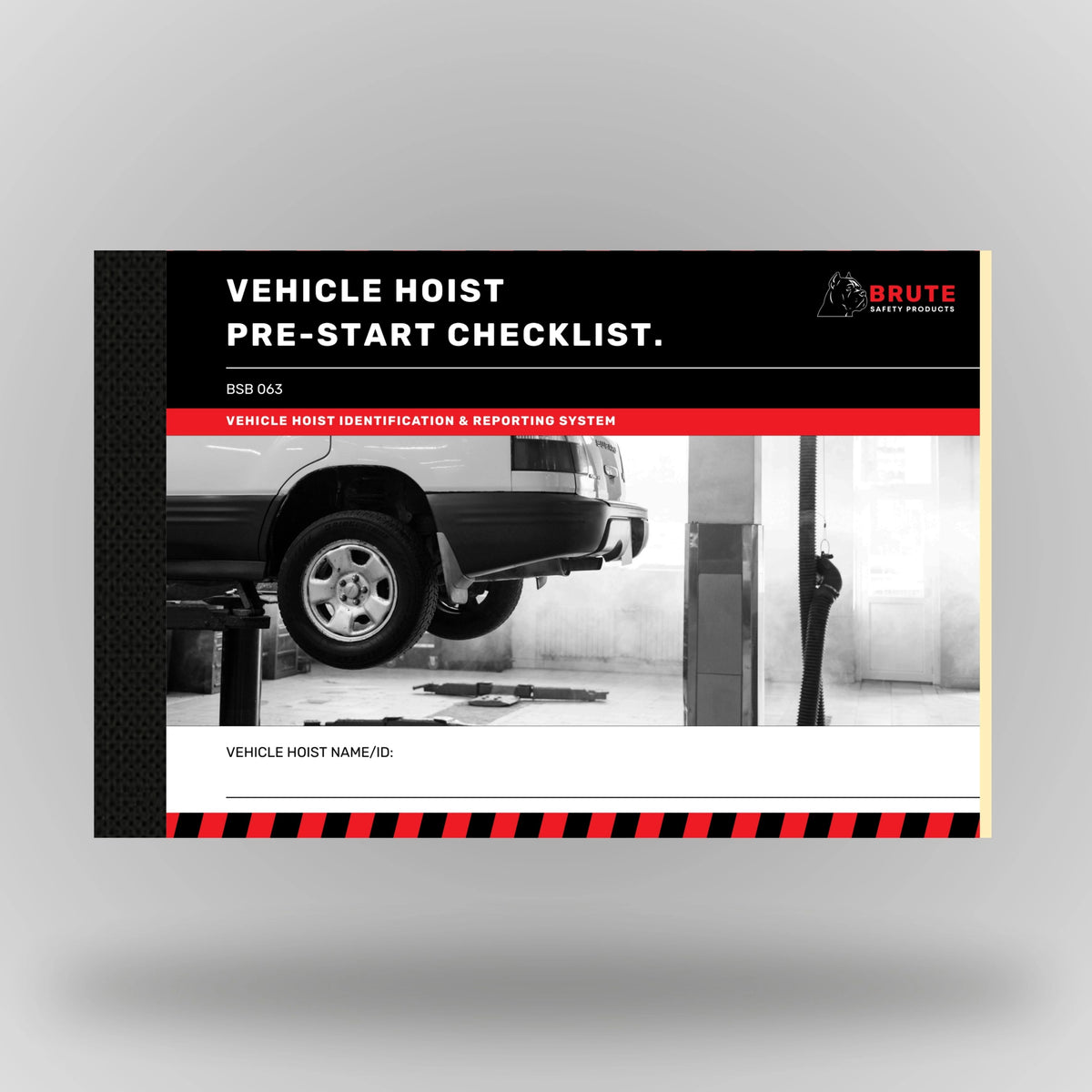 Upright view of BSB 063 Vehicle Hoist Pre Start Checklist book showing product cover with title and taped spine edge.