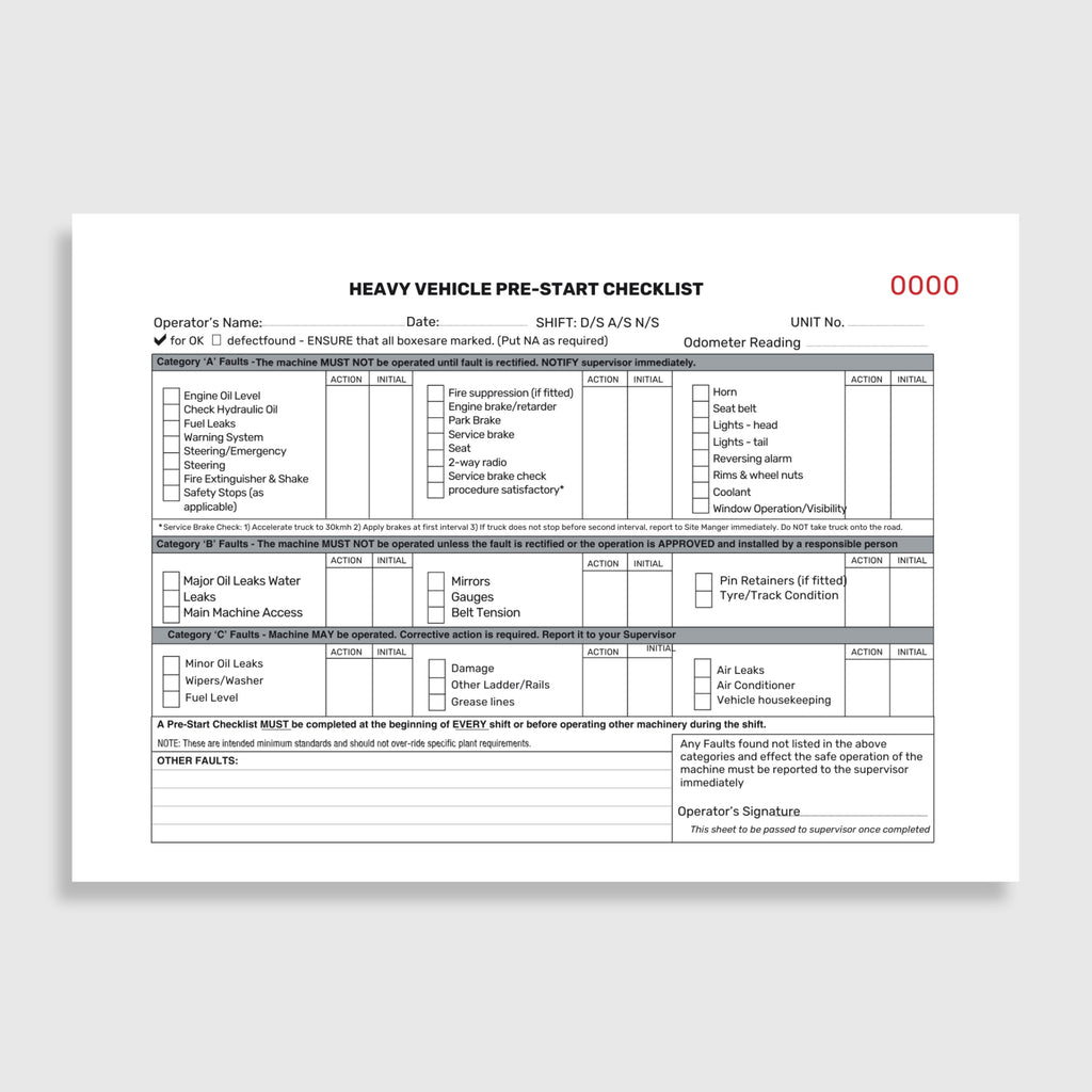 Heavy vehicle pre start checklist book laid flat and open showing duplicate copy pages, taped spine binding and printed inspection fields