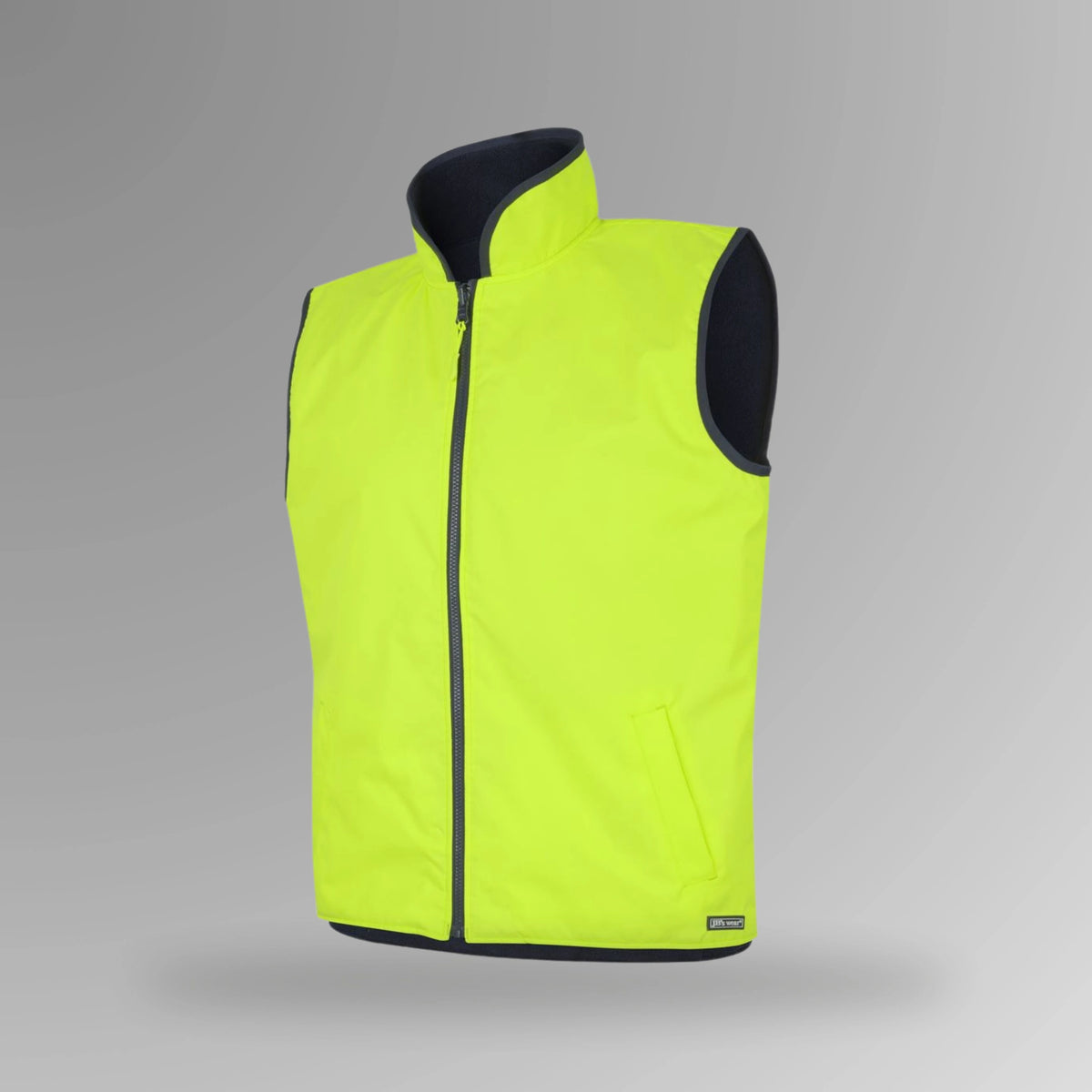 BSC 101 lime and navy hi vis reversible vest in portrait orientation showing fluorescent lime shell with navy fleece lining visible at collar and front pockets