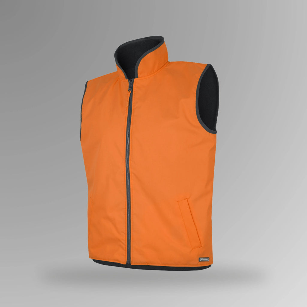 BSC 102 orange and navy hi vis reversible vest in upright view showing fluorescent orange outer shell with navy fleece lining visible at neck and front closure