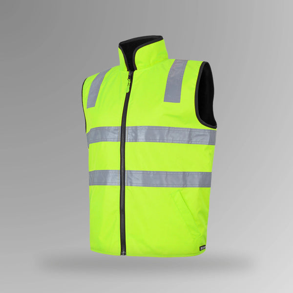BSC 104 lime and navy hi vis reversible taped vest in portrait view showing fluorescent lime shell with reflective tape strips and navy fleece lining visible at collar