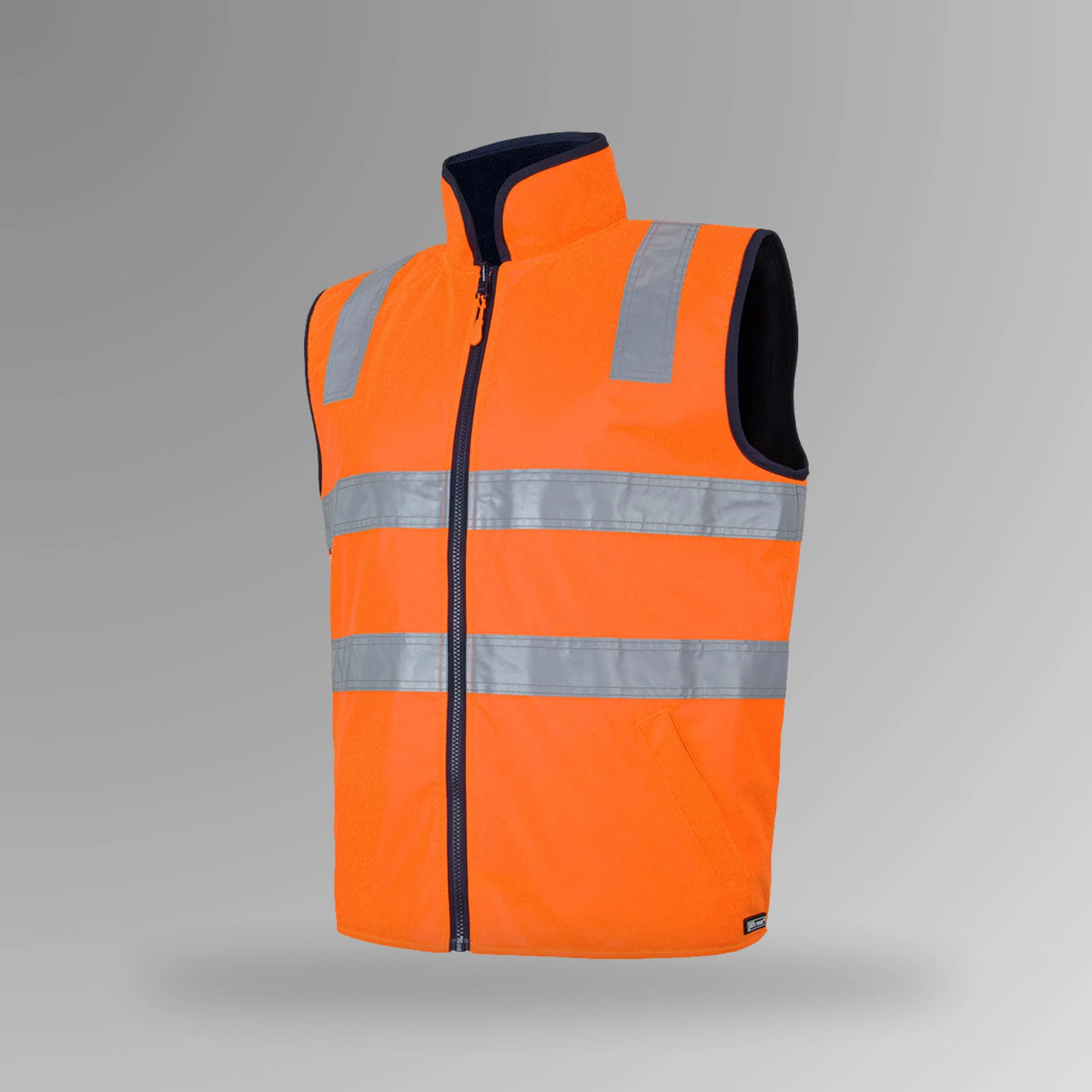 BSC 106 orange and navy hi vis reversible taped vest in portrait view showing fluorescent orange shell with reflective tape and navy fleece lining at collar