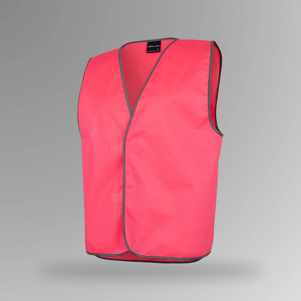 BSC 111 pink hi vis velcro safety vest in portrait orientation showing fluorescent pink body with front flap Hook and pile velcro tape closure and grey contrast binding