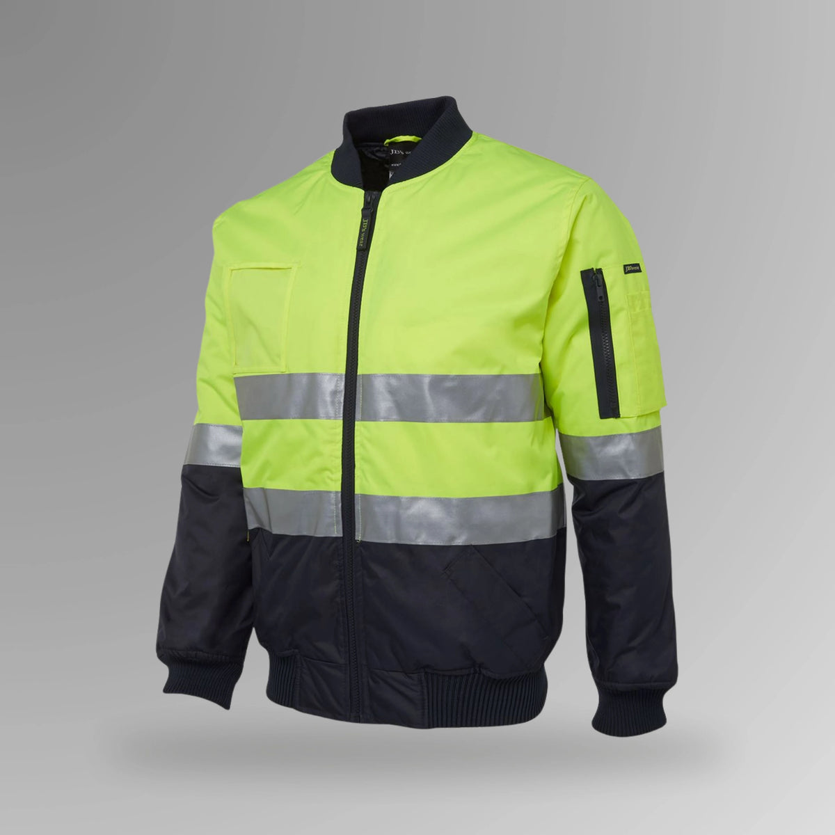 BSC 209 lime and navy hi vis flying taped jacket in portrait orientation showing fluorescent lime body with reflective tape strips, navy contrast, and rib collar