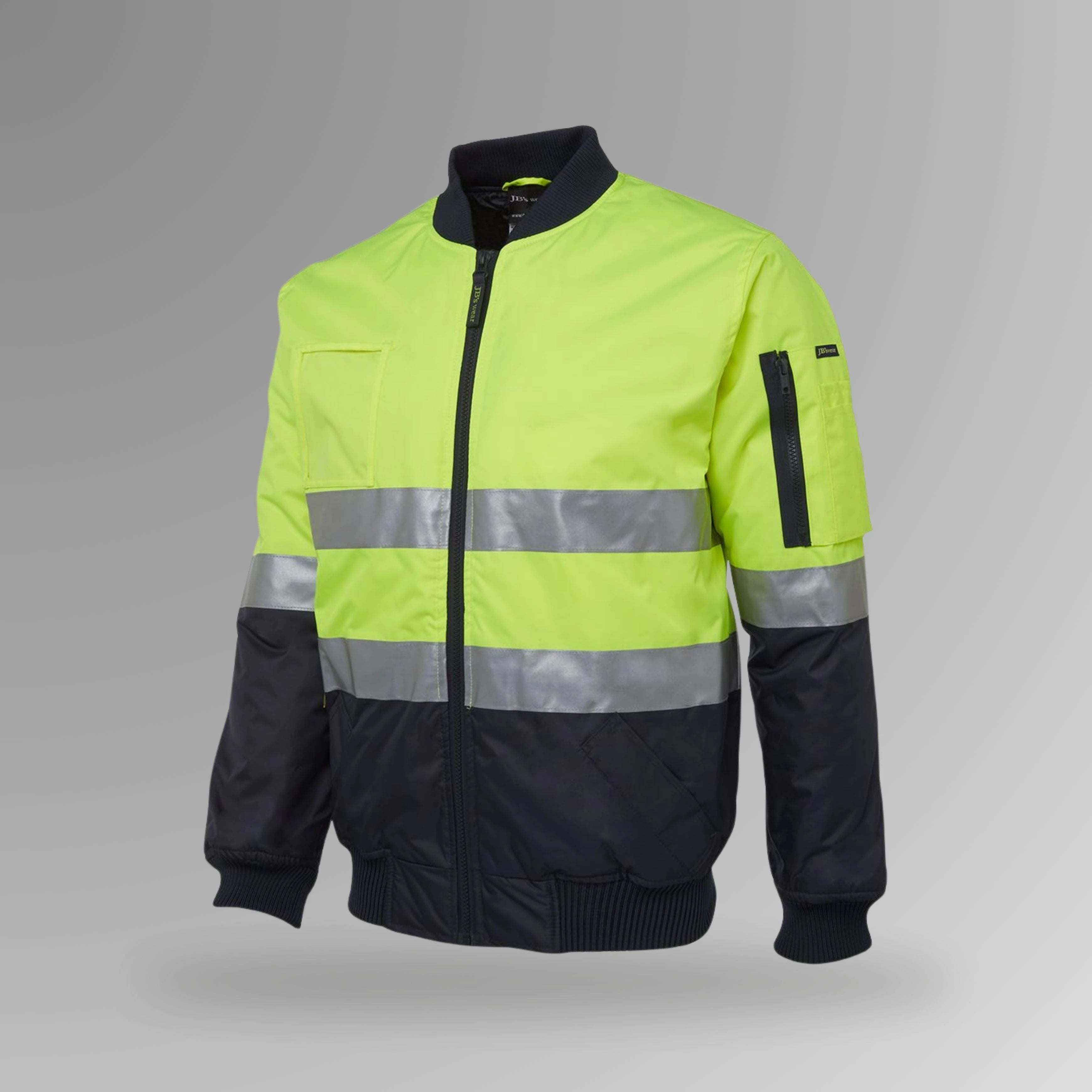 BSC 209 lime and navy hi vis flying taped jacket in portrait orientation showing fluorescent lime body with reflective tape strips, navy contrast, and rib collar