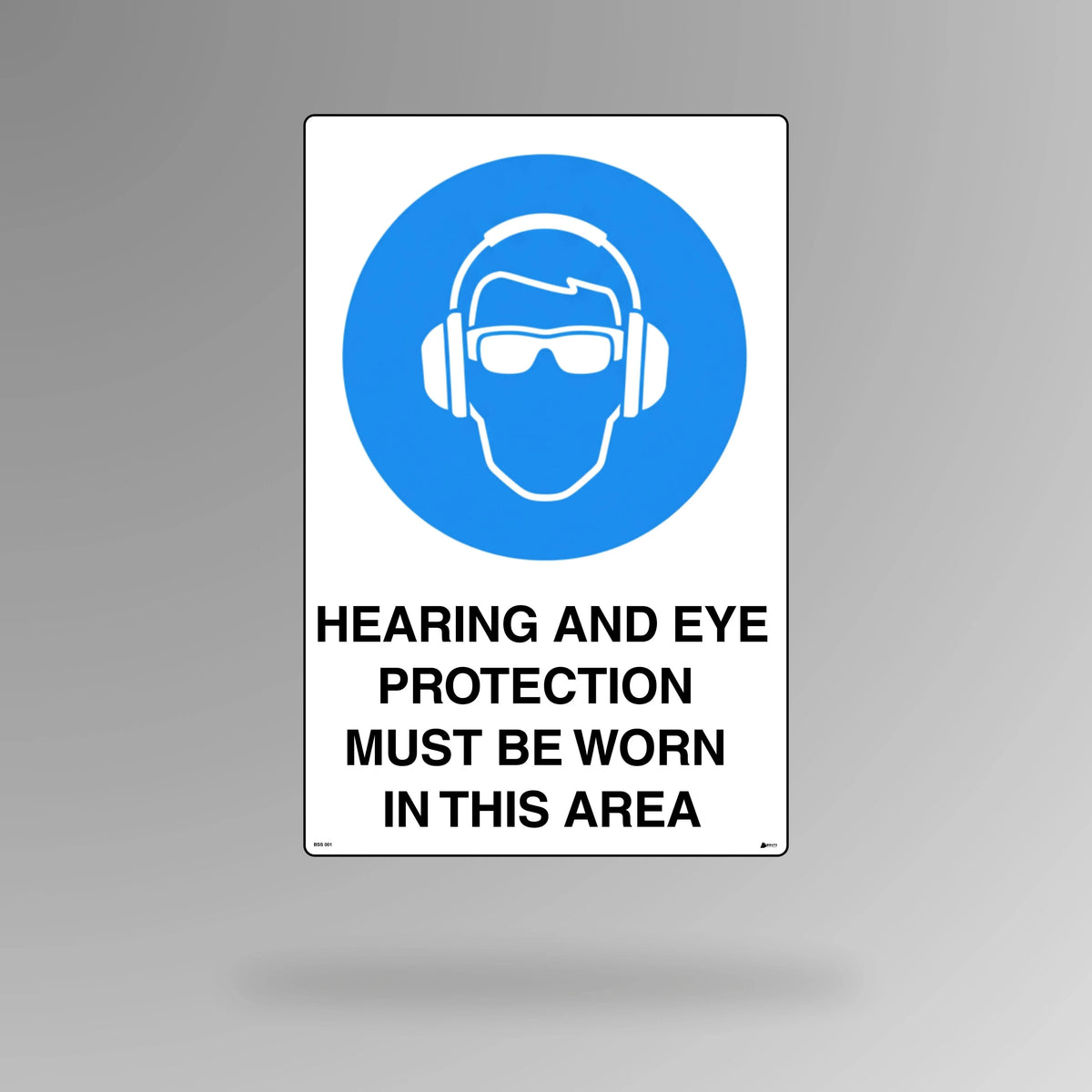 BSS 001 blue and white mandatory safety sign in portrait orientation showing hearing and eye protection symbols with text stating protection must be worn in this area