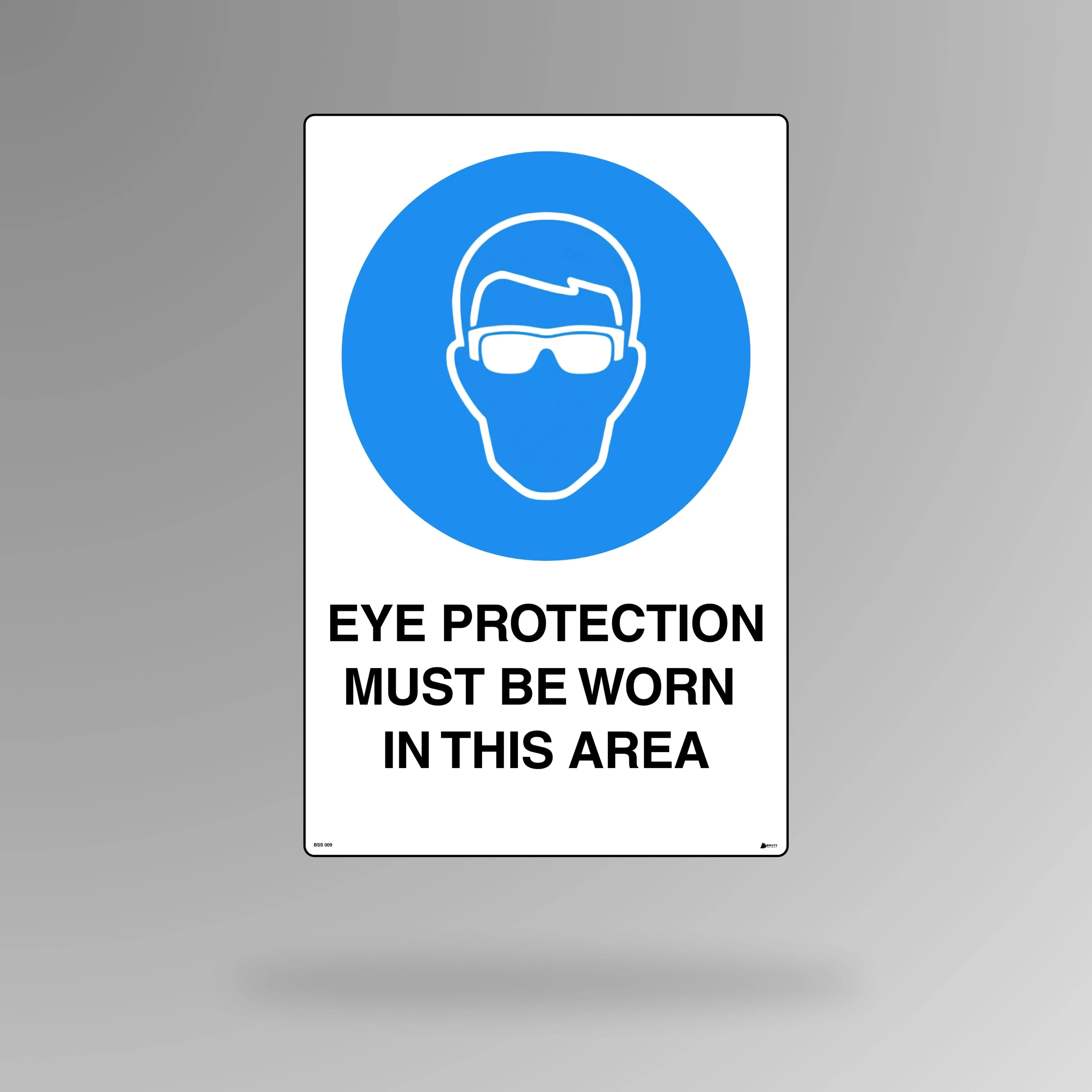 BSS 009 blue and white mandatory safety sign in portrait orientation showing safety glasses symbol with text stating eye protection must be worn in this area