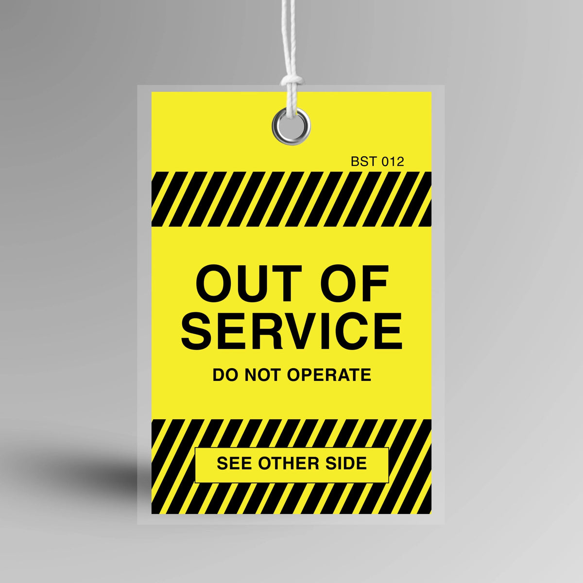 Yellow BST 012 Tamper Proof Out of Service Tag displayed upright showing clear out of service text and attachment hole