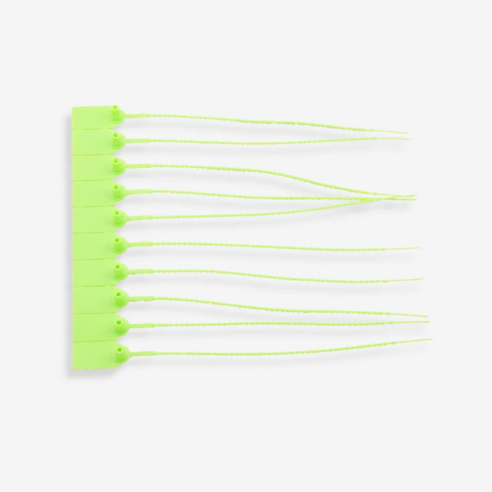 BST 214 green security pull tag shown flat revealing complete dimensions and tamper proof construction