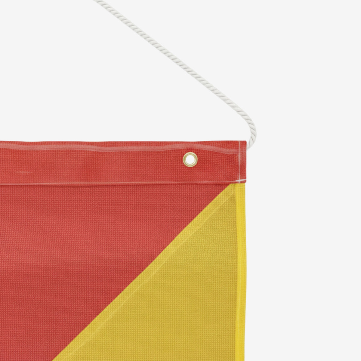 Layflat display of 450mm x 450mm oversized load flag featuring red and yellow colour scheme with metal eyelet reinforcement detail