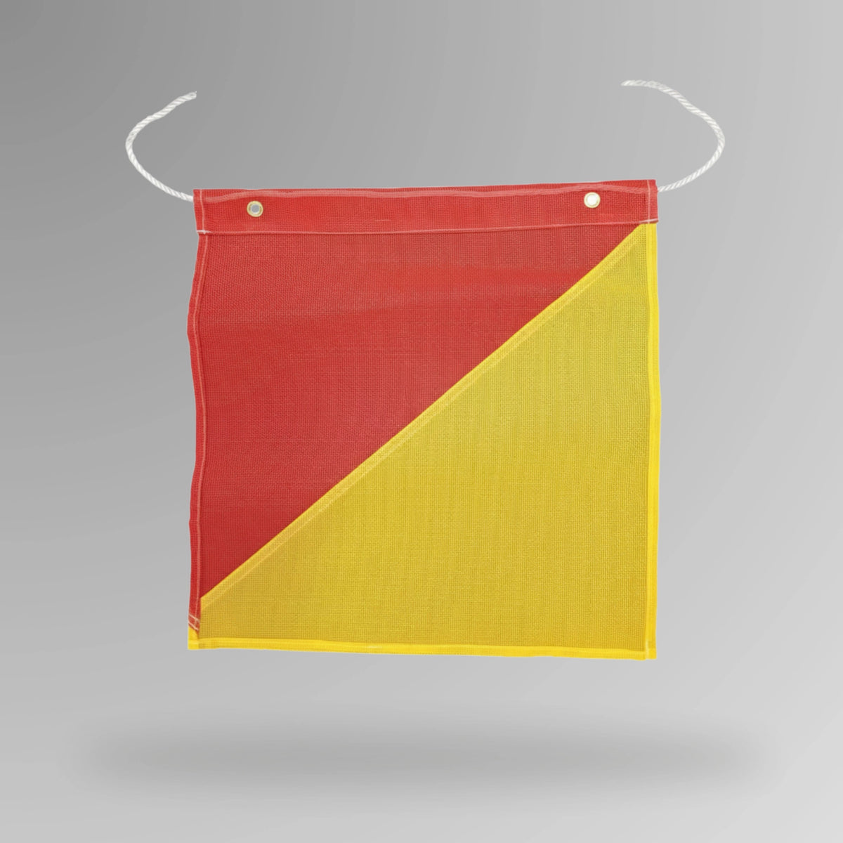 Upright view of red and yellow oversized load flag showing 450mm square dimensions with two metal eyelets for attachment