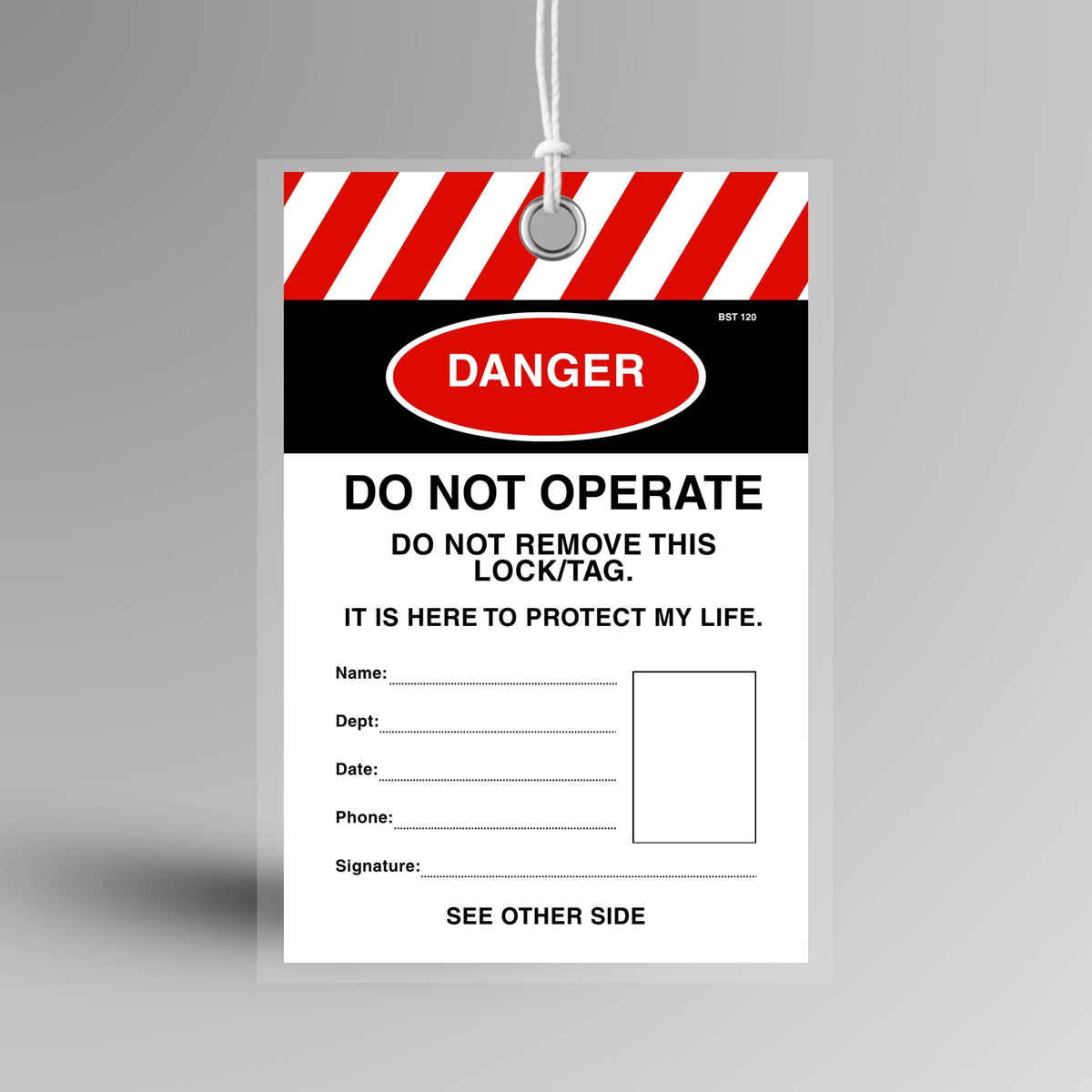 Red and white Danger Do Not Operate lockout tag with photo ID panel and fields for name, department, date, phone and signature. Features 8mm reinforced metal eyelet, tearproof synthetic stock, plastic tamper proof shield and weatherproof no fade ink.