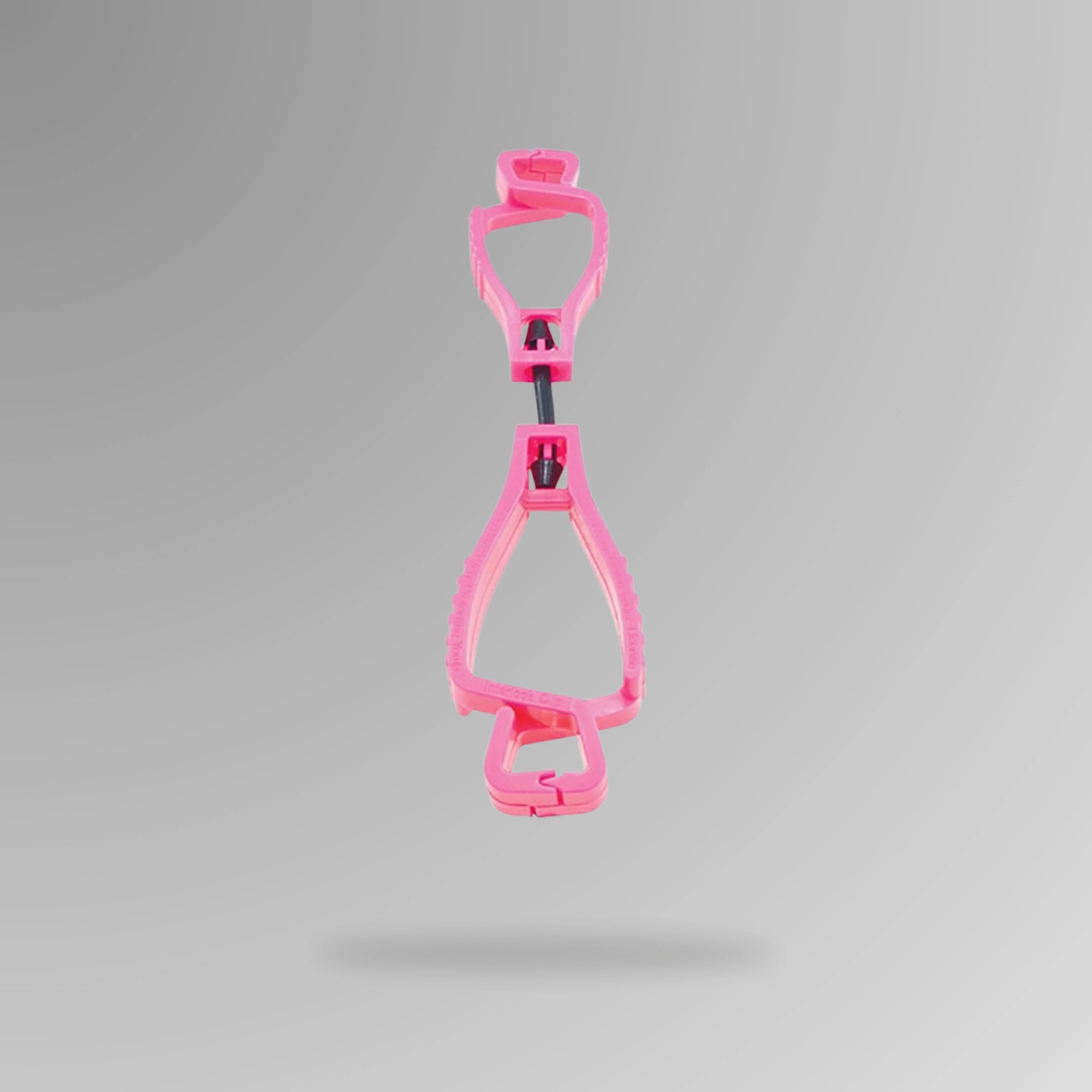 PPE 157 Interlocking Glove Clip in pink shown upright in durable POM plastic with breakaway cord and Brute Safety Products branding