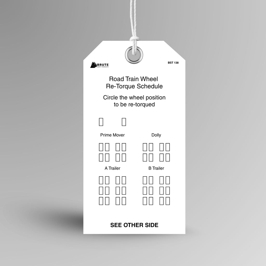 BST 138 Road Train Wheel Re-Torque Schedule tag hanging from white string through a metal eyelet, with wheel diagrams for prime mover, dolly, A Trailer and B Trailer.