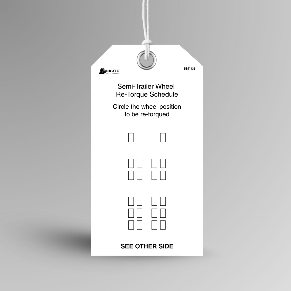 BST 136 Semi Trailer Wheel Re-Torque Schedule tag hanging from white string through a metal eyelet, showing a trailer wheel position diagram.