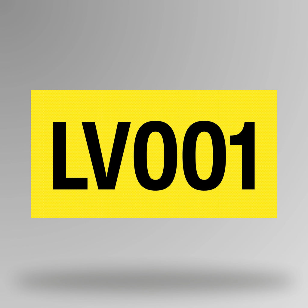 Yellow reflective vinyl asset decal shown in upright position with black printed asset number visible against bright yellow background